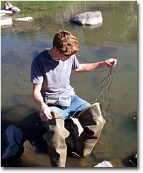 Kevin McAlerney preparing to take water temperature measurements of the Pit River. 